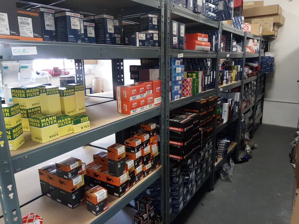 Genuine auto parts UAE — branded oil and air filter spare parts in a parts warehouse